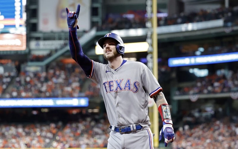 Jonah Heim #28 of the Texas Rangers celebrates after hitting a solo home run against Framber Valdez #59 of the Houston Astros. The Astros vs Rangers Odds are set for tonight's game.