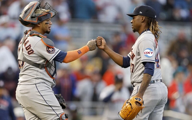 Martín Maldonado #15 and Rafael Montero #47 of the Houston Astros celebrate after beating the Minnesota Twins 9-1 in Game Three of the Division Series at Target Field on October 10, 2023 in Minneapolis, Minnesota.