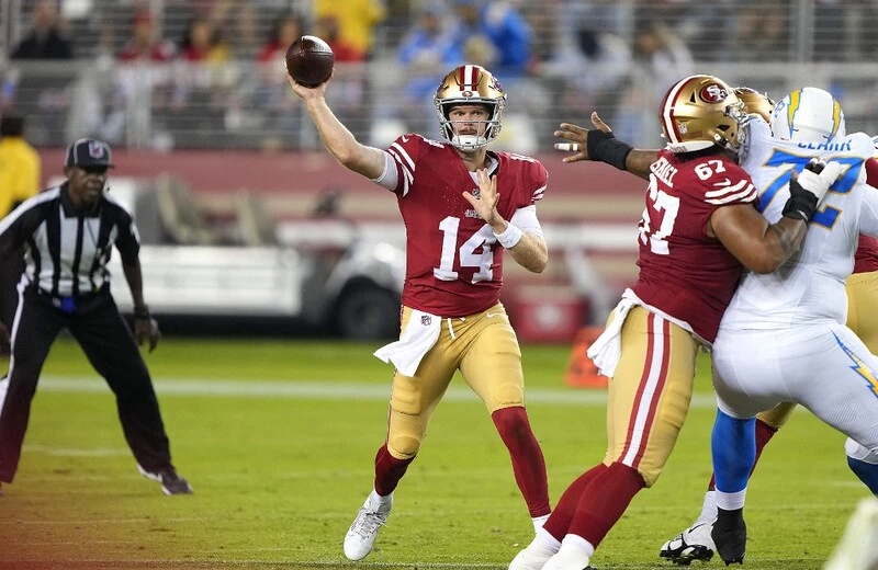 Sam Darnold #14 of the San Francisco 49ers throws a pass against the Los Angeles Chargers during the second quarter of a preseason game at Levi's Stadium on August 25, 2023 in Santa Clara, California. The Bengals vs 49ers betting odds are already set.