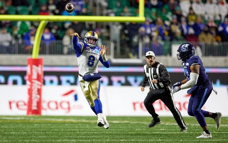 Zach Collaros #8 of the Winnipeg Blue Bombers throws in the run in the first half of the 109th Grey Cup game between the Toronto Argonauts and Winnipeg Blue Bombers at Mosaic Stadium on November 20, 2022 in Regina, Canada. The Blue Bombers vs Stampeders Betting is about to start.