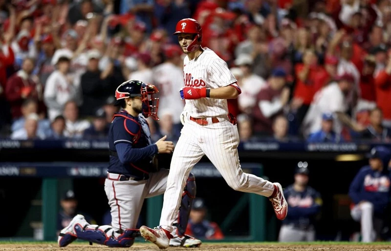 rea Turner #7 of the Philadelphia Phillies rounds the bases after hitting a solo home run against the Atlanta Braves during the sixth inning in Game Three of the Division Series.
