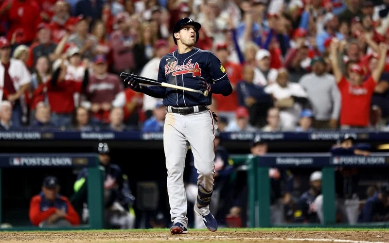 Austin Riley #27 of the Atlanta Braves reacts after striking out against the Philadelphia Phillies during the seventh inning in Game Three of the Division Series.