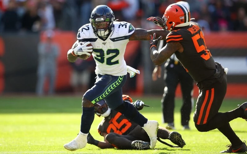 Chris Carson #32 of the Seattle Seahawks runs the ball against the Cleveland Browns at FirstEnergy Stadium on October 13, 2019 in Cleveland, Ohio. The Browns vs Seahawks betting odds are already set.