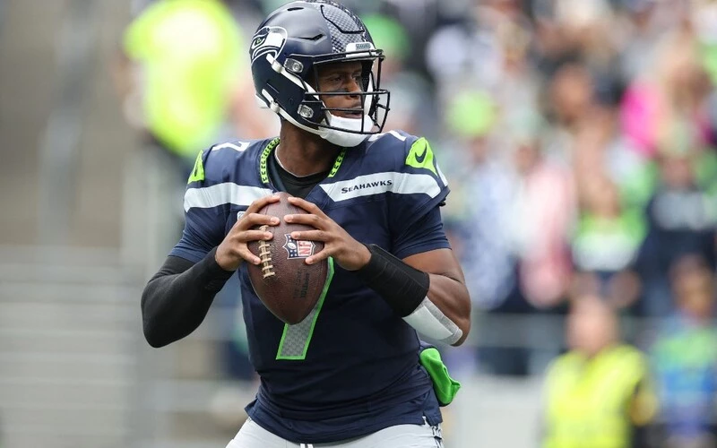 Geno Smith #7 of the Seattle Seahawks looks to throw the ball in the first half of the game against the Arizona Cardinals at Lumen Field on October 22, 2023 in Seattle, Washington. The Browns vs Seahawks betting odds are already set.