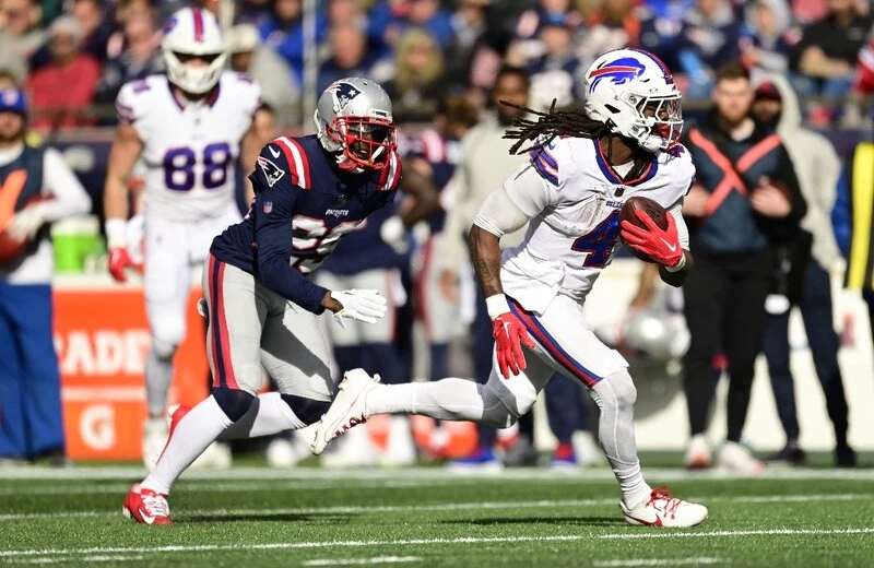James Cook #4 of the Buffalo Bills carries the ball during a game against the New England Patriots at Gillette Stadium on October 22, 2023 in Foxborough, Massachusetts. The Buccaneers vs Bills Odds are ready for Thursday's game.