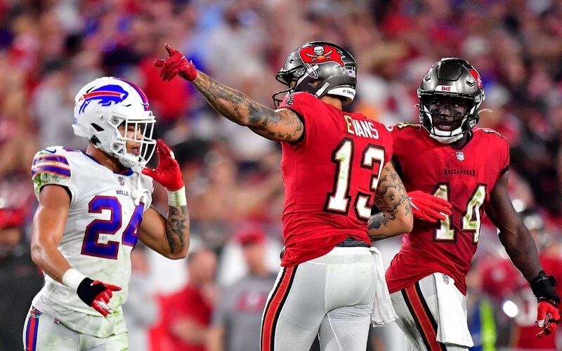 Mike Evans #13 of the Tampa Bay Buccaneers celebrates a first down during the fourth quarter against the Buffalo Bills at Raymond James Stadium on December 12, 2021 in Tampa, Florida. The Buccaneers vs Bills Odds are ready for Thursday's game.