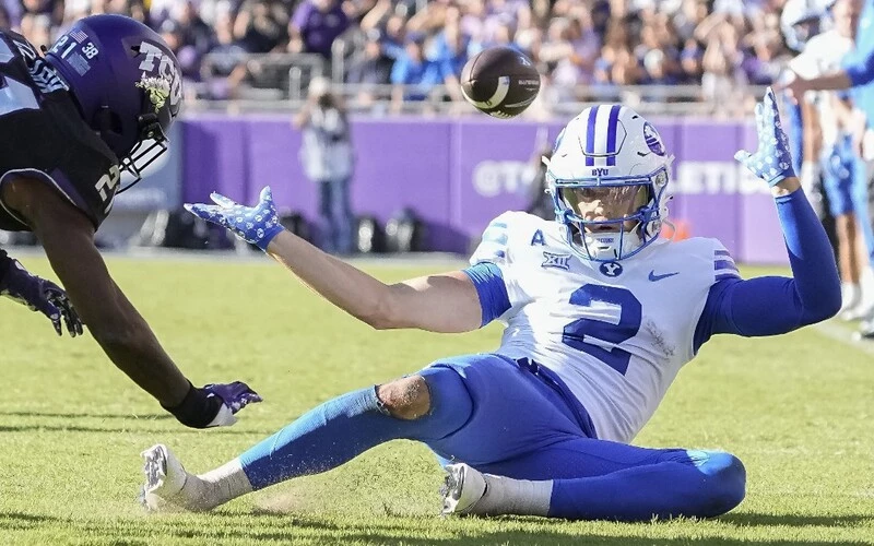 Chase Roberts #2 of the Brigham Young Cougars can't make the catch on a pass intended for him during the first half against the TCU Horned Frogs at Amon G. Carter Stadium on October 14, 2023 in Fort Worth, Texas. The BYU vs Texas Odds are set for Saturday's game.