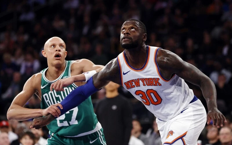 Julius Randle #30 of the New York Knicks guards Jordan Walsh #27 of the Boston Celtics during the first half of a preseason game at Madison Square Garden on October 09, 2023 in New York City. The Celtics vs Knicks Odds are set for tonight's game.