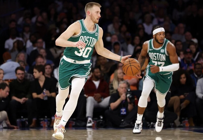 Sam Hauser #30 of the Boston Celtics dribbles during the first half of a preseason game against the New York Knicks at Madison Square Garden on October 09, 2023 in New York City. The Celtics vs Knicks Odds are set for tonight's game.