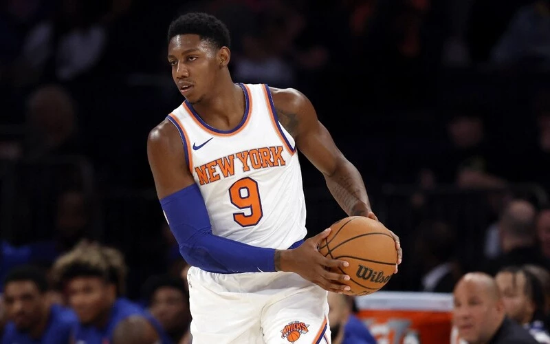 RJ Barrett #9 of the New York Knicks dribbles during the first half of a preseason game against the Boston Celtics at Madison Square Garden on October 09, 2023 in New York City. The Celtics vs Knicks Odds are set for tonight's game.