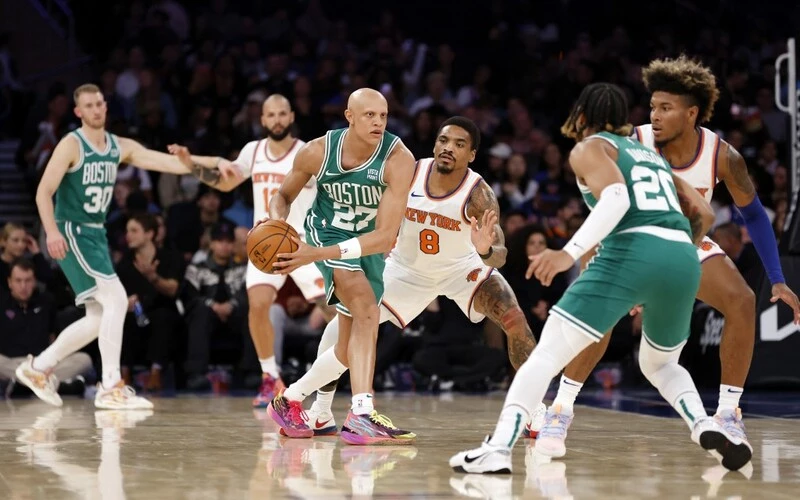 Jordan Walsh #27 of the Boston Celtics controls the ball as DaQuan Jeffries #8 of the New York Knicks defends during the second half of a preseason game at Madison Square Garden on October 09, 2023 in New York City. The Knicks won 114-107. The Celtics vs Knicks Odds are set for tonight's game.