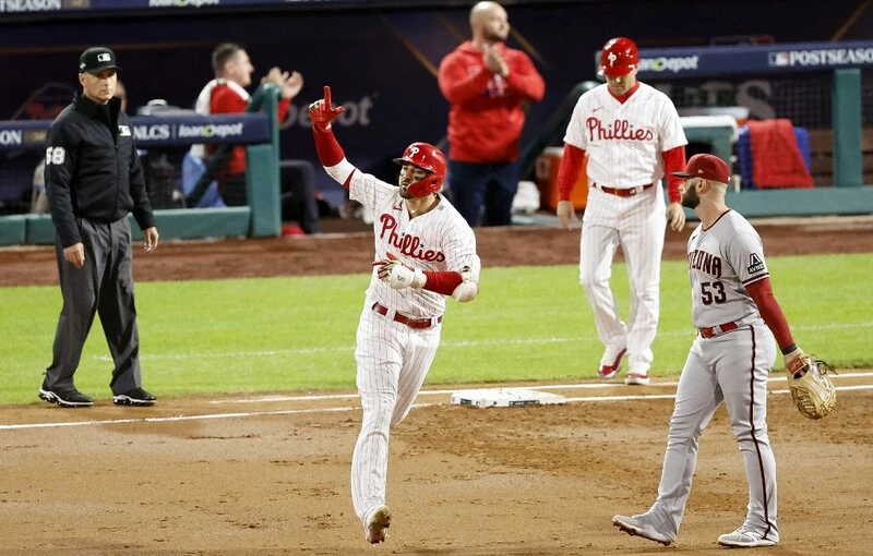 Nick Castellanos #8 of the Philadelphia Phillies rounds the bases after hitting a solo home run in the second inning against the Arizona Diamondbacks during Game One of the Championship Series