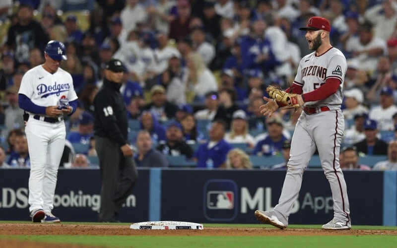 Christian Walker #53 of the Arizona Diamondbacks celebrates after completing a double play against the Los Angeles Dodgers to end the eighth inning in Game Two of the Division Series at Dodger Stadium on October 09, 2023 in Los Angeles, California.