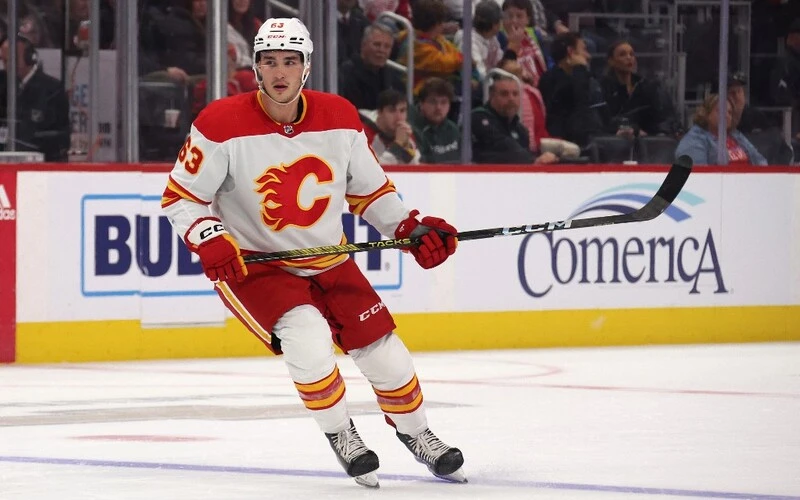 Adam Ruzicka #63 of the Calgary Flames skates against the Detroit Red Wings at Little Caesars Arena on October 22, 2023 in Detroit, Michigan. The Flames vs Oilers Odds are already set.