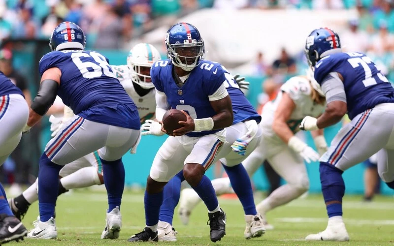 yrod Taylor #2 of the New York Giants receives the snap against the Miami Dolphins.