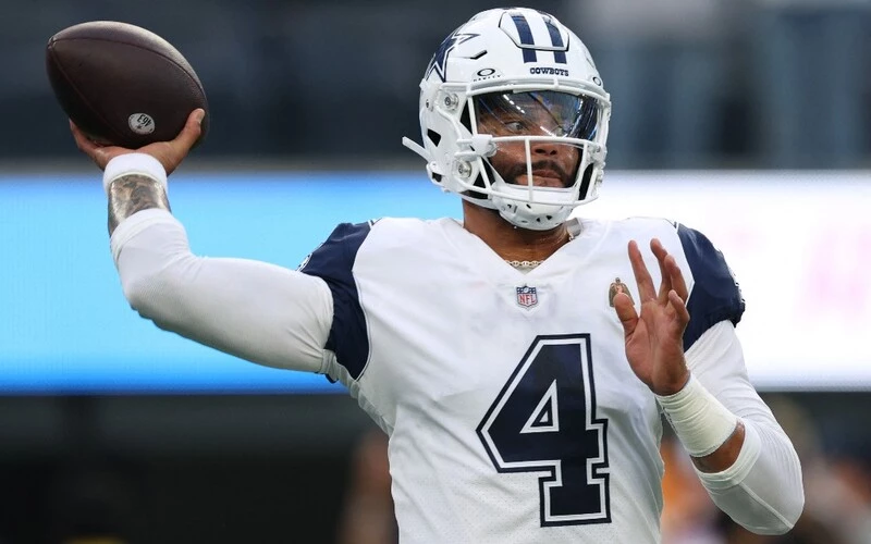 Dak Prescott #4 of the Dallas Cowboys during warm up before the game against the Los Angeles Chargers at SoFi Stadium on October 16, 2023 in Inglewood, California. The Rams vs Cowboys betting odds are set.