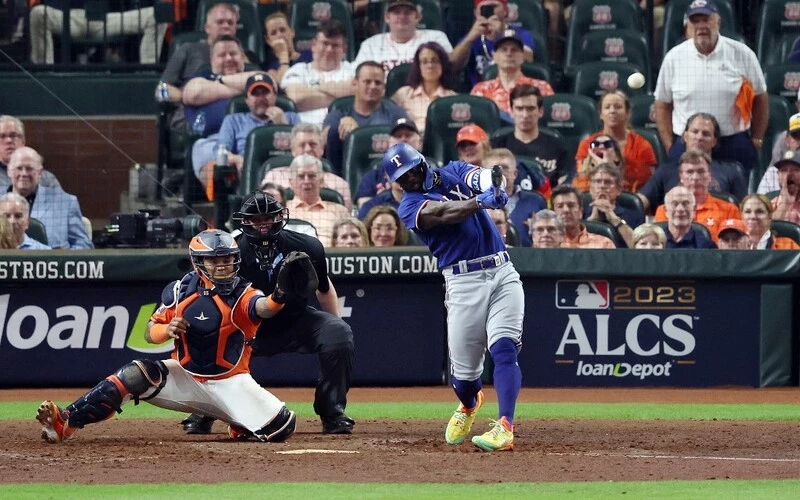 Adolis Garcia #53 of the Texas Rangers hits a grand slam home run against Ryne Stanek #45 of the Houston Astros during the ninth inning in Game Six of the American League Championship Series at Minute Maid Park on October 22, 2023 in Houston, Texas. The Rangers vs Astros Odds are ready to analyze.