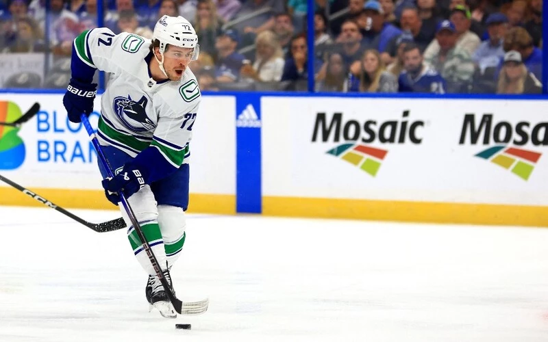 Anthony Beauvillier #72 of the Vancouver Canucks looks to pass first period during a game against the Tampa Bay Lightning at Amalie Arena on October 19, 2023 in Tampa, Florida. The Rangers vs Canucks Odds are already set.