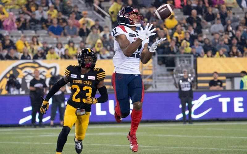 Montreal Alouettes wide receiver Kaion Julien-Grant (11) makes a catch during second half CFL football game action against the Hamilton Tiger Cats in Hamilton, Ont. on Friday, June 23, 2023. The Tiger-Cats vs Alouettes betting odds for this game are truly interesting for analyze.