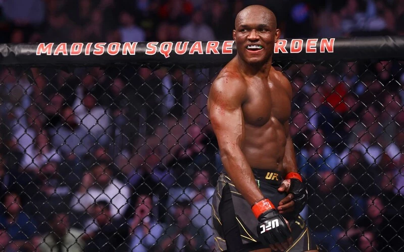 Kamaru Usman smiles against Colby Covington in their welterweight title bout during the UFC 268 event at Madison Square Garden. The Usman vs Chimaev Prediction is a close one.