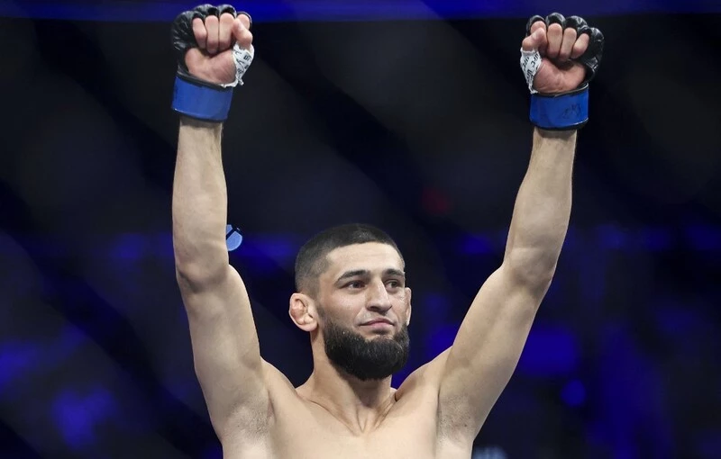 Khamzat Chimaev of Russia reacts as he is introduced for his welterweight fight against Gilbert Burns. The Usman vs Chimaev Prediction is a close one.