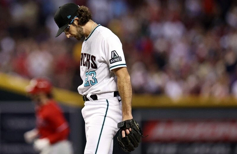 Zac Gallen #23 of the Arizona Diamondbacks reacts after giving up a home run to Bryce Harper #3 of the Philadelphia Phillies during the sixth inning in Game Five of the National League Championship Series at Chase Field on October 21, 2023 in Phoenix, Arizona. The Dbacks vs Rangers odds are set for tonight's game.