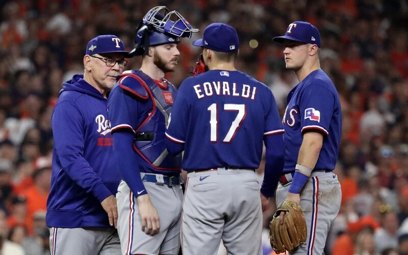 Manager Bruce Bochy #15 of the Texas Rangers relieves Nathan Eovaldi #17 against the Houston Astros during the seventh inning in Game Six of the American League Championship Series at Minute Maid Park on October 22, 2023 in Houston, Texas. The Dbacks vs Rangers odds are set for tonight's game.